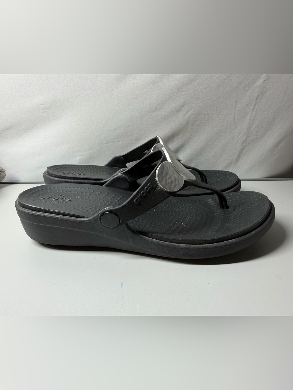 CROCS Black Thong Sandals with Silver Medallion Size 8